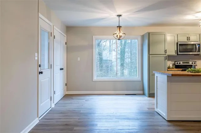 a view of a kitchen from the hallway