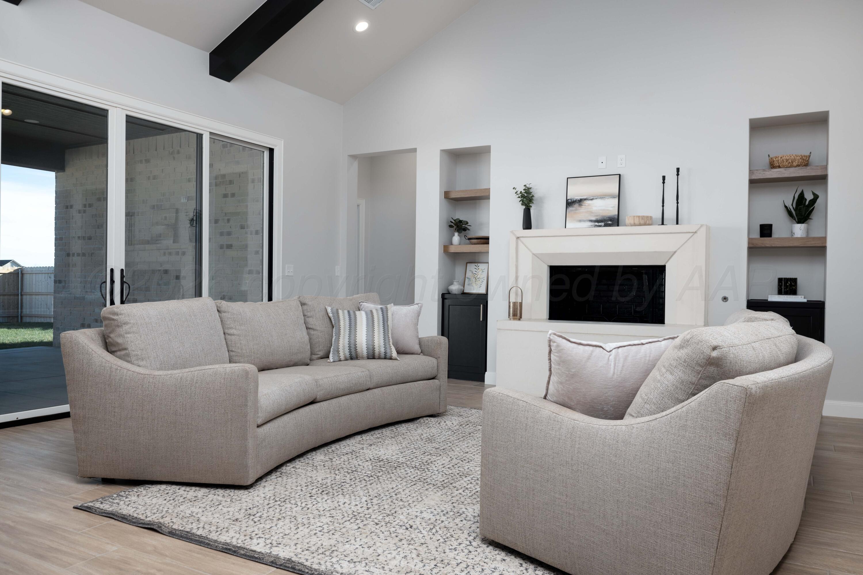 10250 Prickly Pear Road Amarillo, TX 79119 - Photo 2 of 41 a living room with furniture and a fireplace
