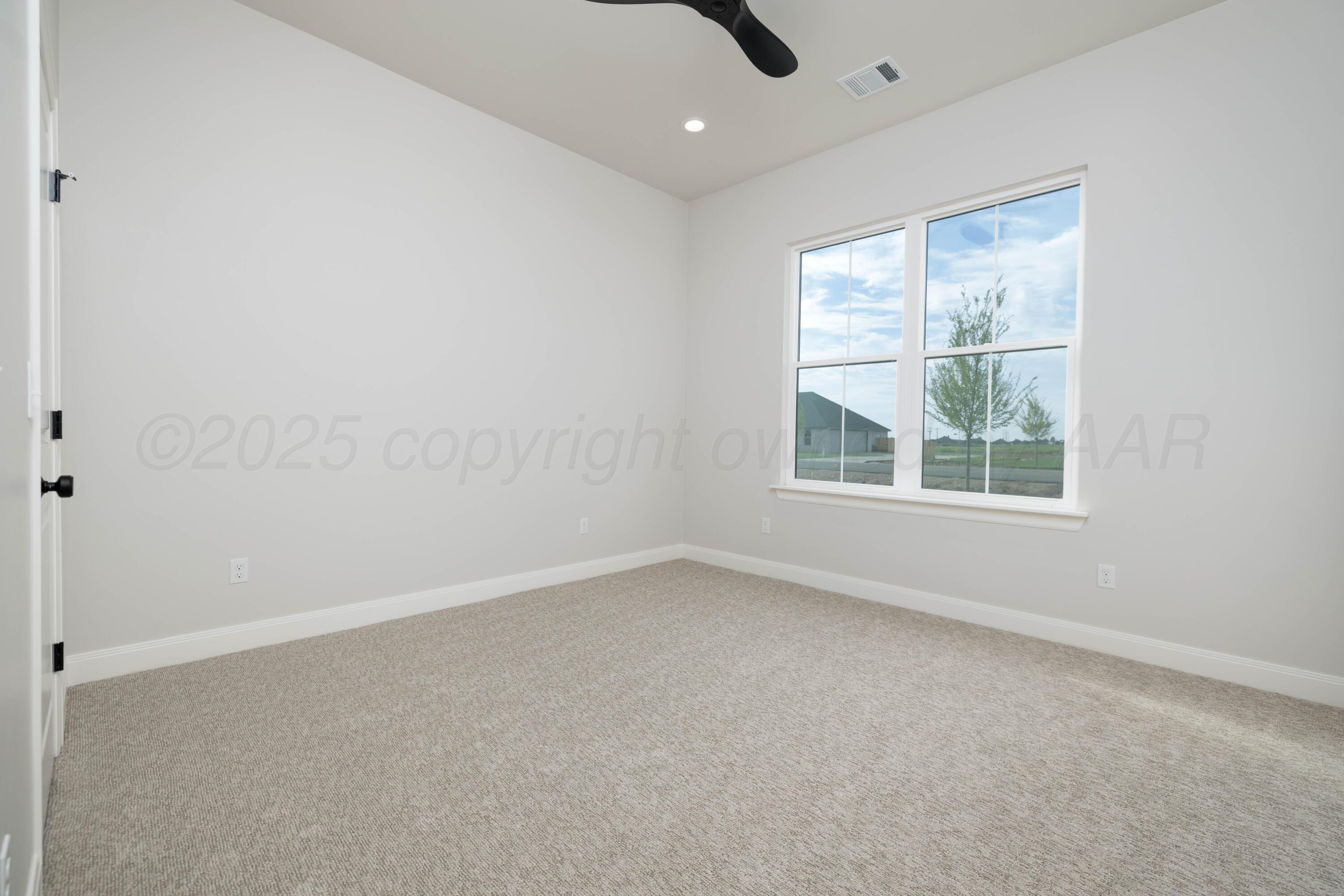 10250 Prickly Pear Road Amarillo, TX 79119 - Photo 21 of 41 an empty room with a window