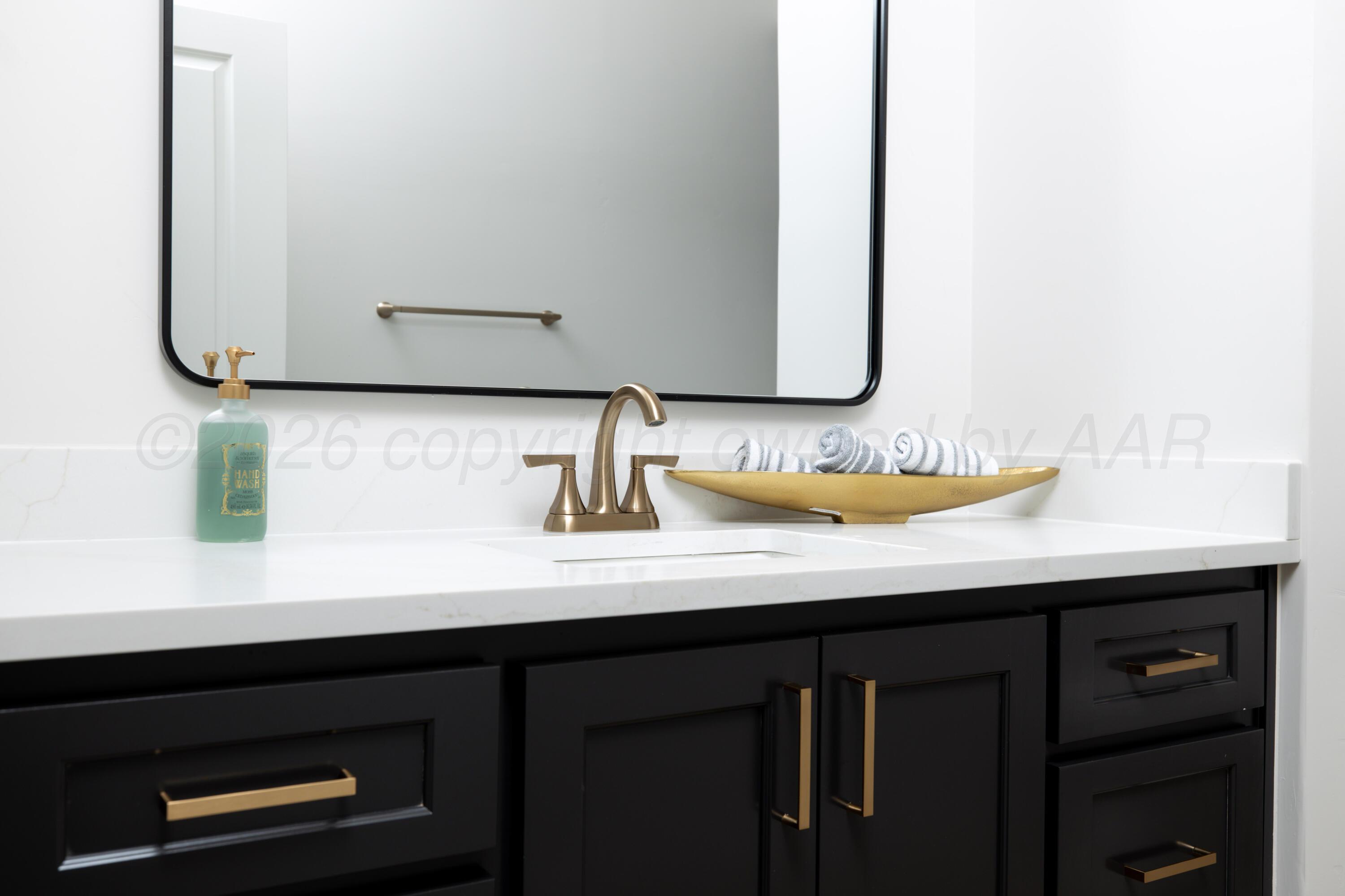 10250 Prickly Pear Road Amarillo, TX 79119 - Photo 23 of 41 a bathroom with a sink and a mirror