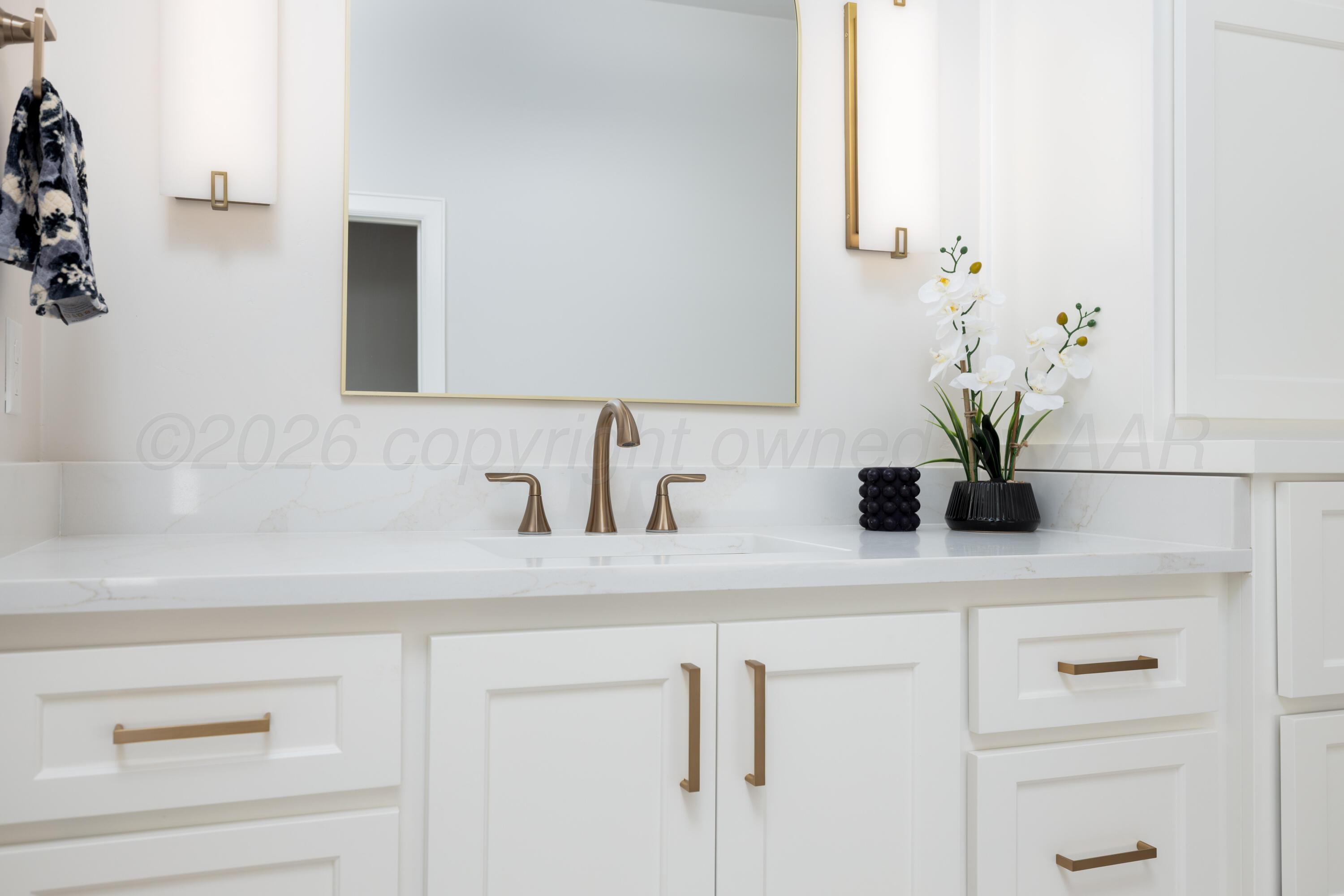 10250 Prickly Pear Road Amarillo, TX 79119 - Photo 26 of 41 a bathroom with a sink and a mirror