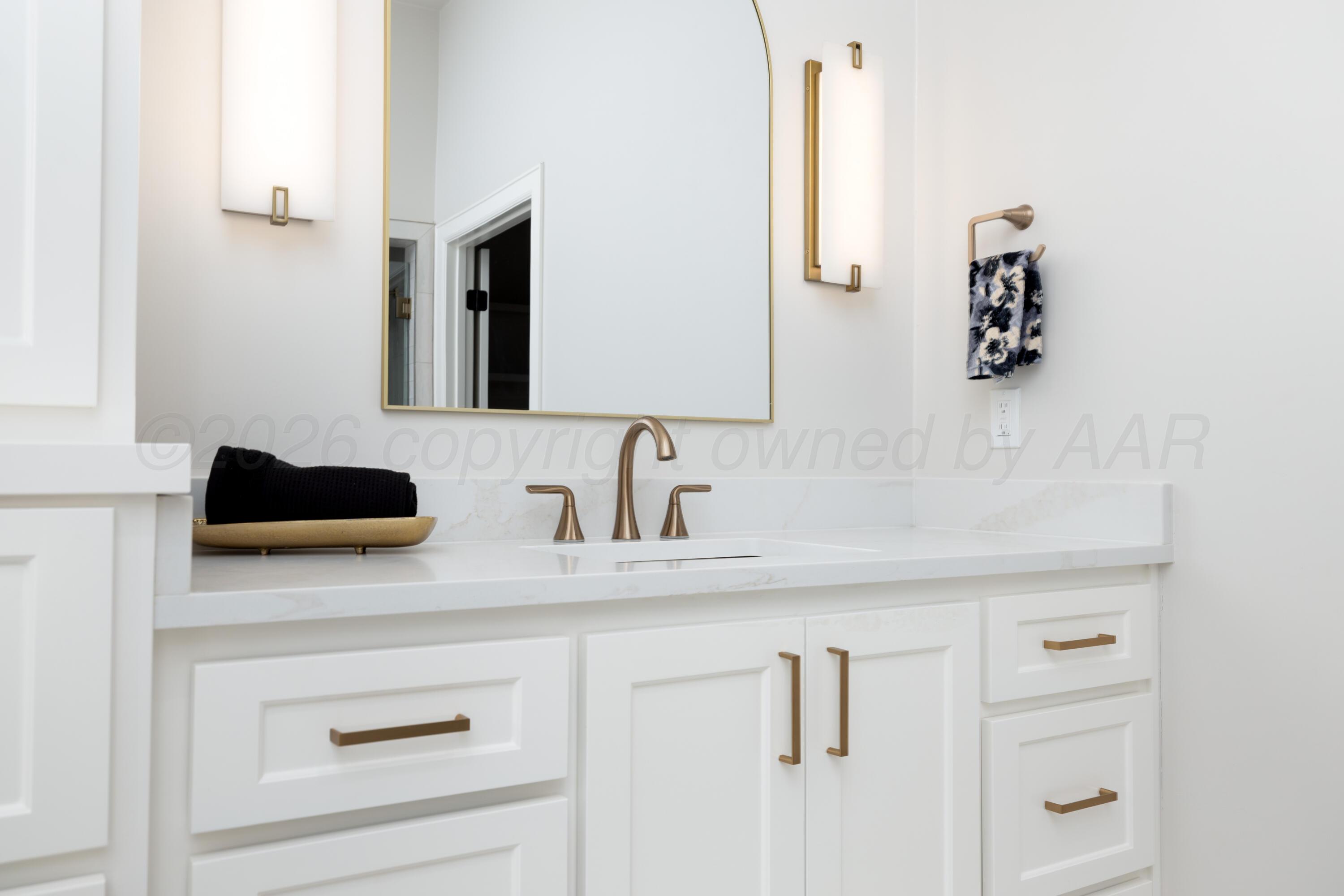 10250 Prickly Pear Road Amarillo, TX 79119 - Photo 27 of 41 a bathroom with a sink and a mirror