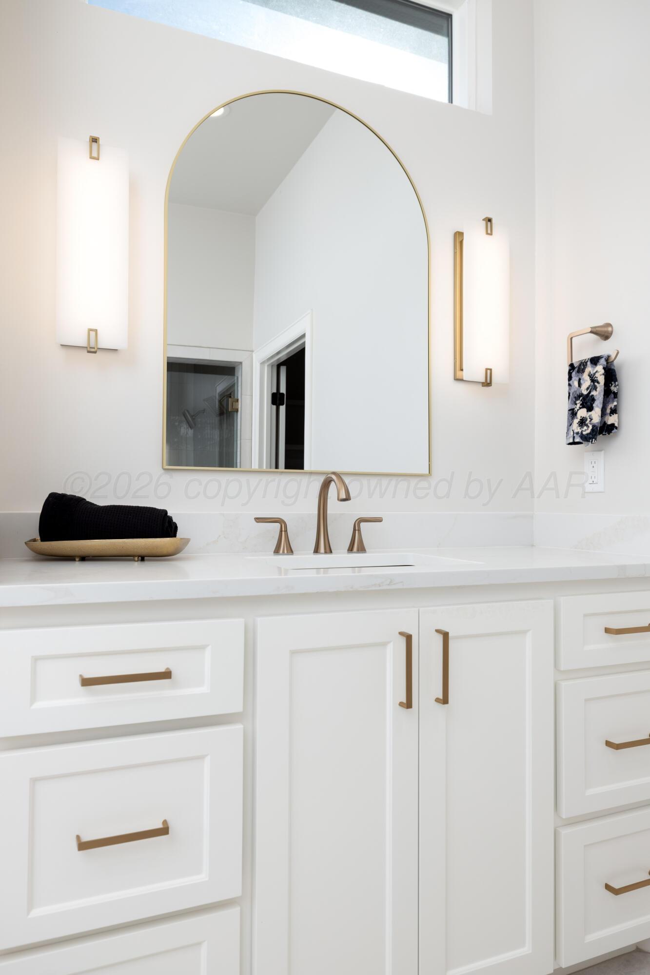 10250 Prickly Pear Road Amarillo, TX 79119 - Photo 28 of 41 a bathroom with a sink and a mirror