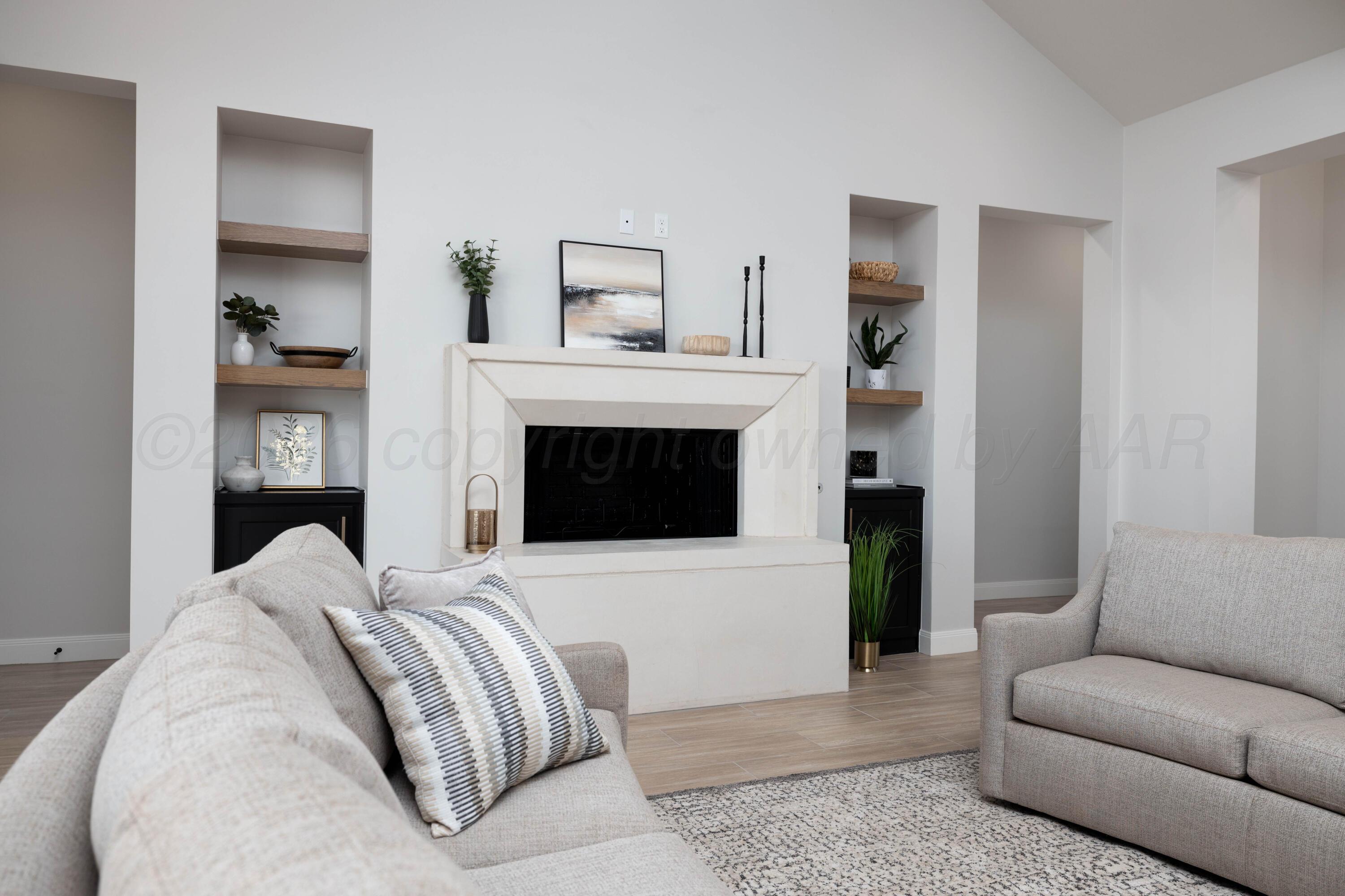 10250 Prickly Pear Road Amarillo, TX 79119 - Photo 3 of 41 a living room with furniture and a fireplace