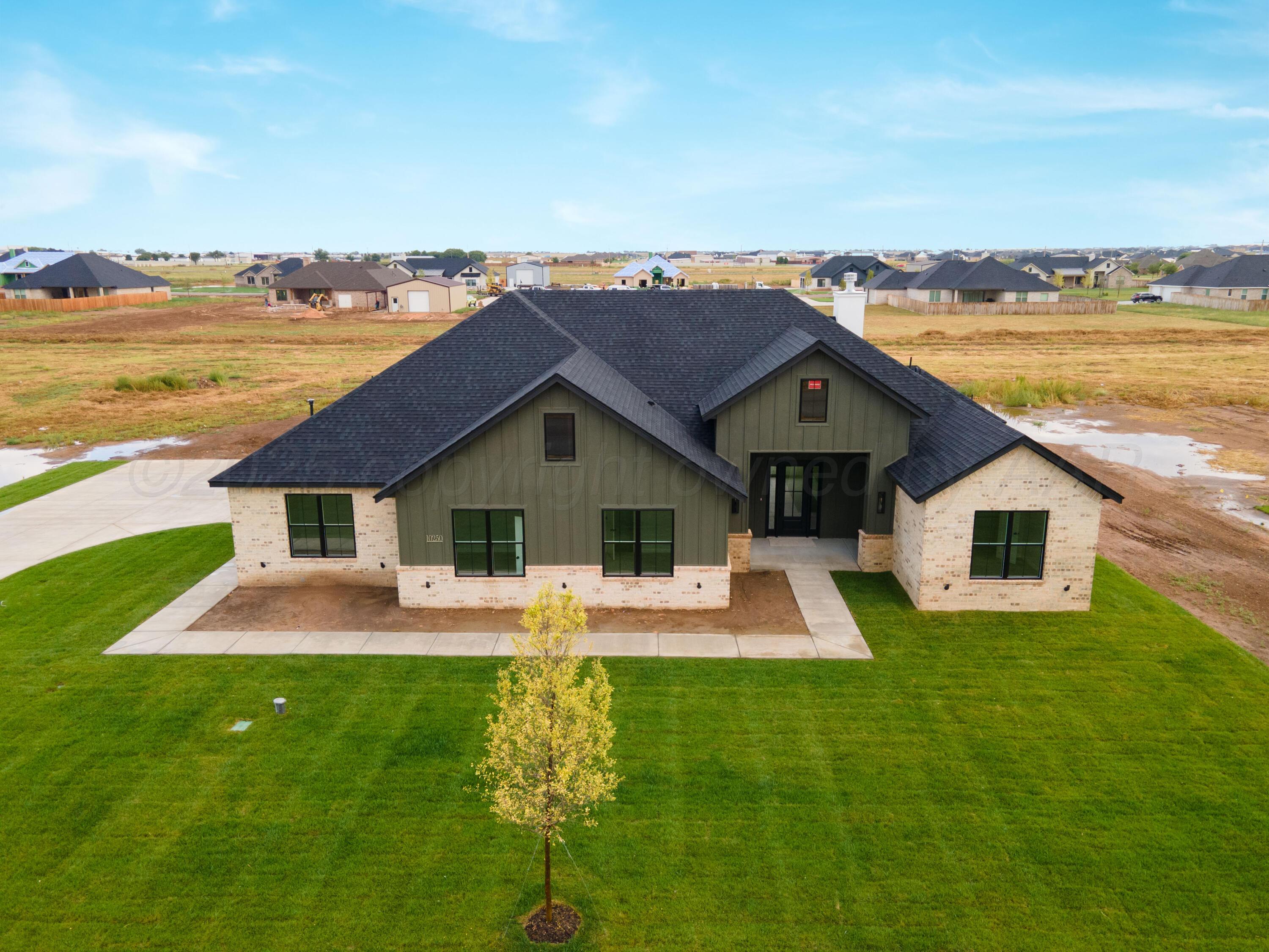 10250 Prickly Pear Road Amarillo, TX 79119 - Photo 37 of 41 a front view of house with yard and lake view