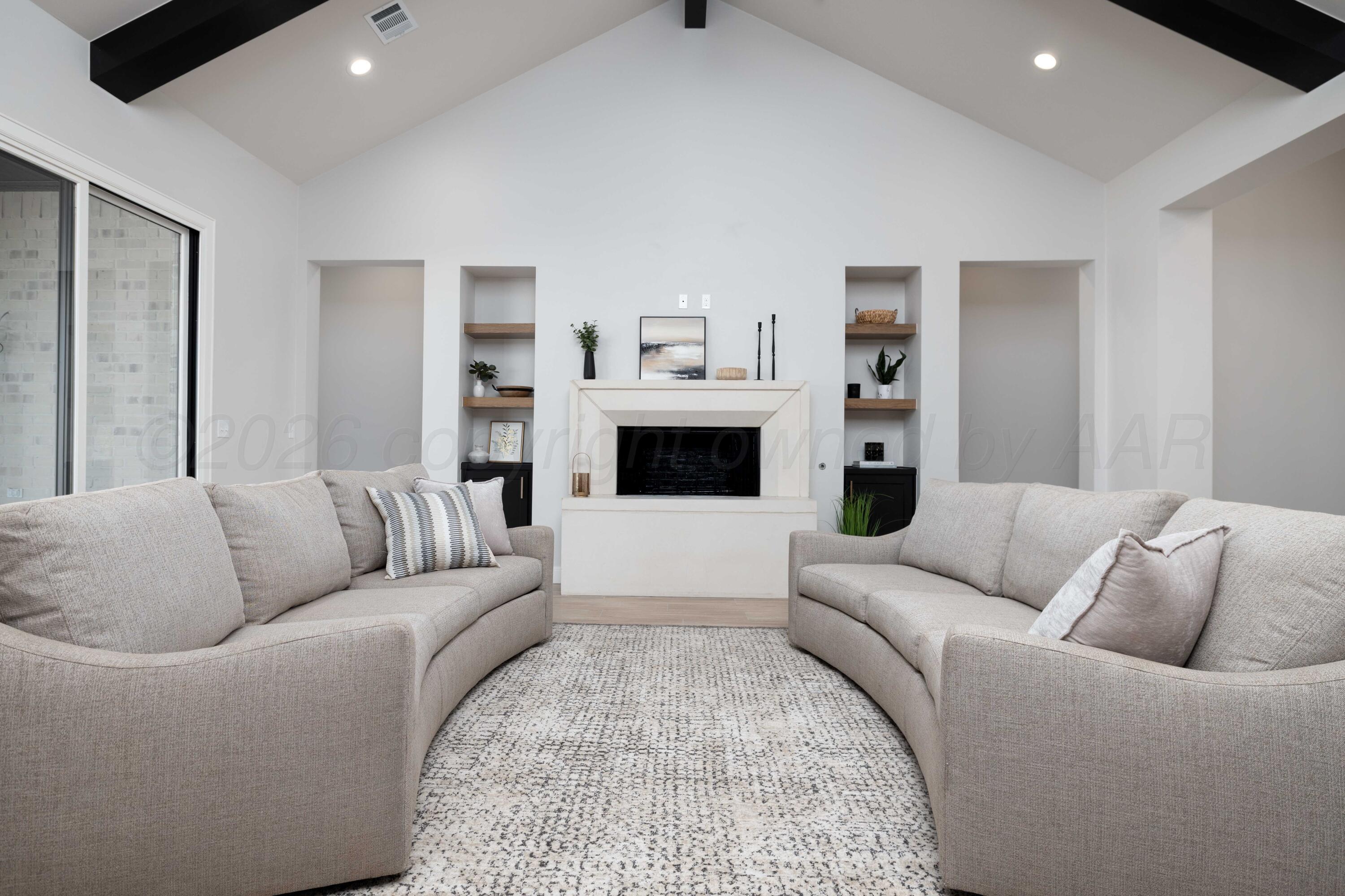 10250 Prickly Pear Road Amarillo, TX 79119 - Photo 4 of 41 a living room with furniture and a fireplace