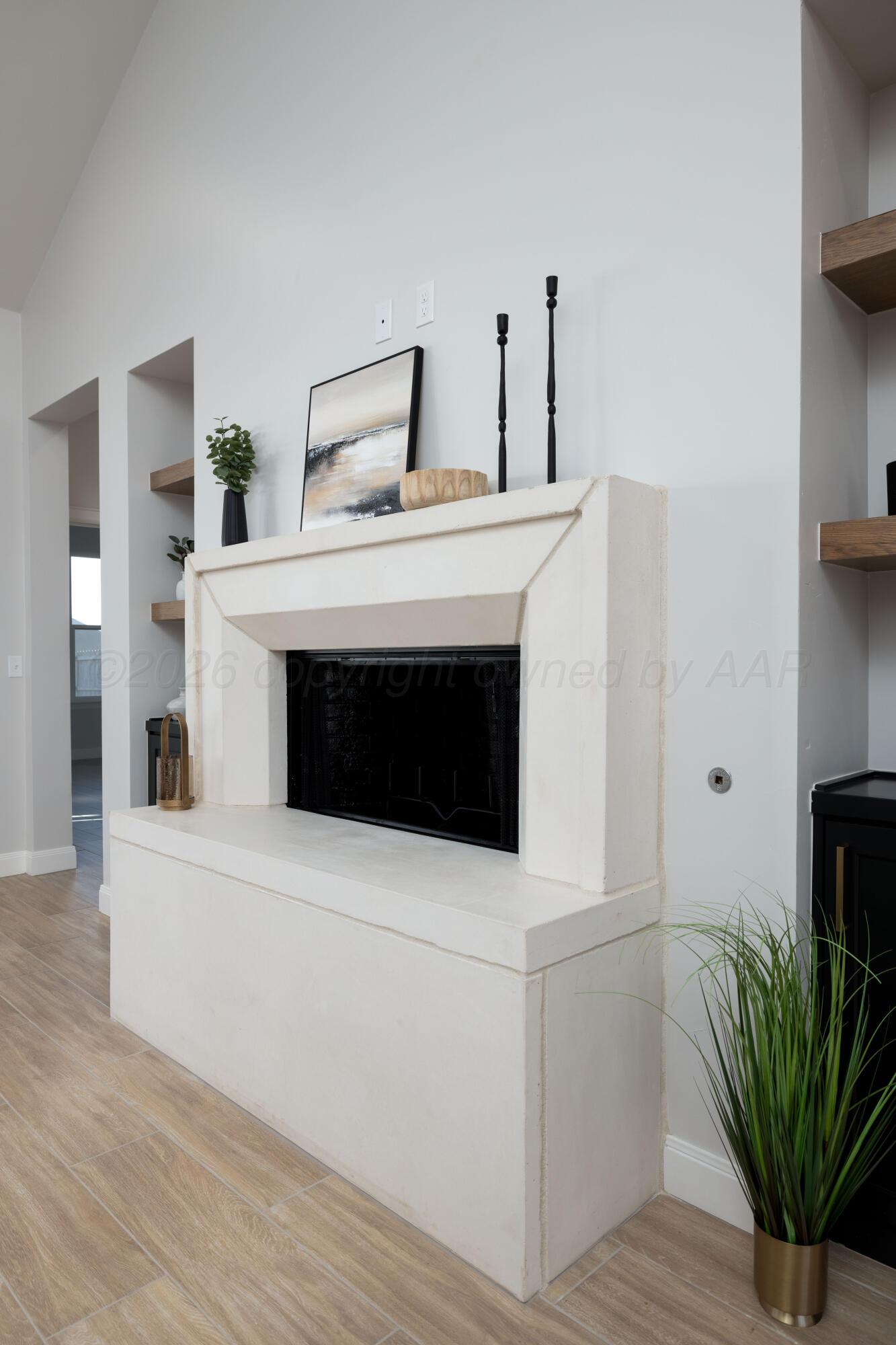 10250 Prickly Pear Road Amarillo, TX 79119 - Photo 5 of 41 a utility room with a fireplace and wooden floor
