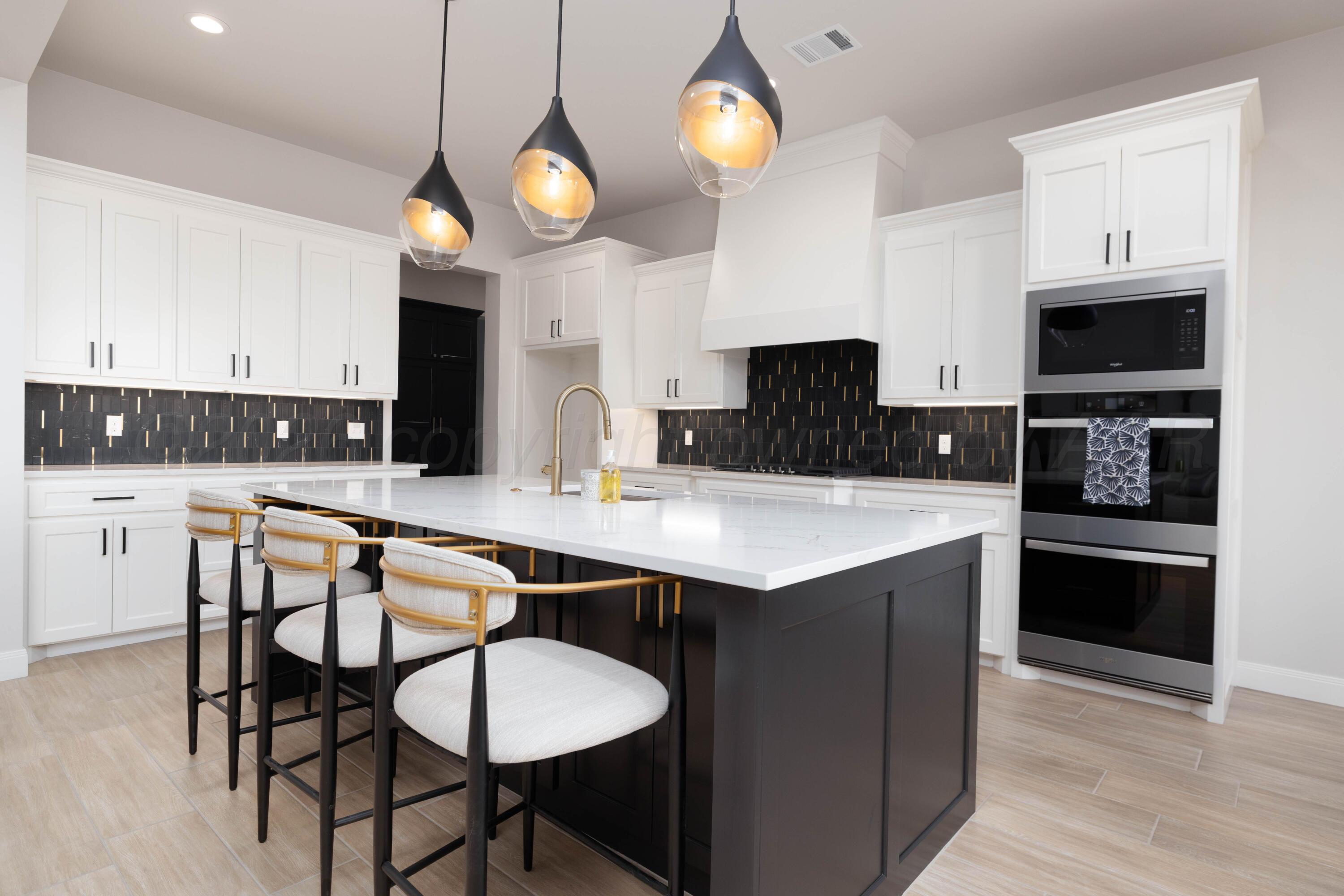 10250 Prickly Pear Road Amarillo, TX 79119 - Photo 8 of 41 a kitchen with stainless steel appliances a stove a sink and a refrigerator