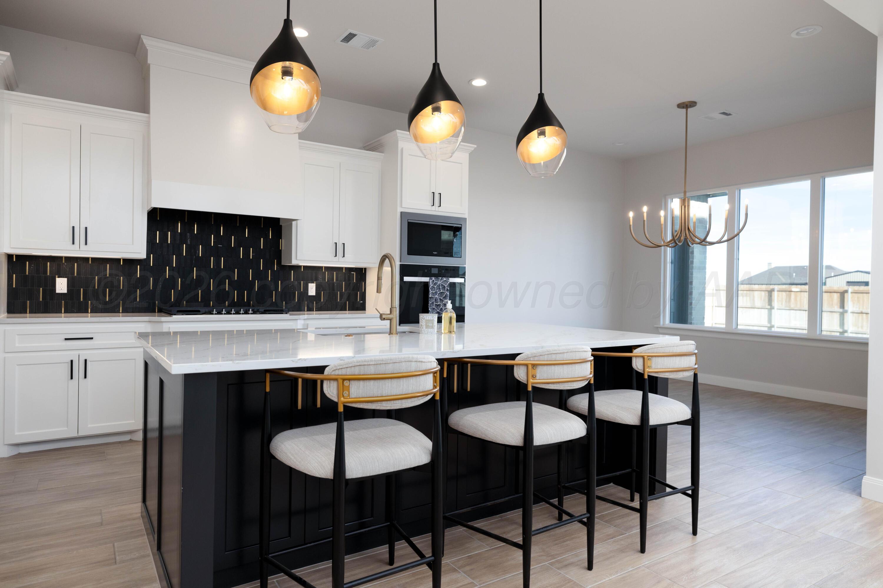 10250 Prickly Pear Road Amarillo, TX 79119 - Photo 9 of 41 a kitchen that has a table and chairs in it