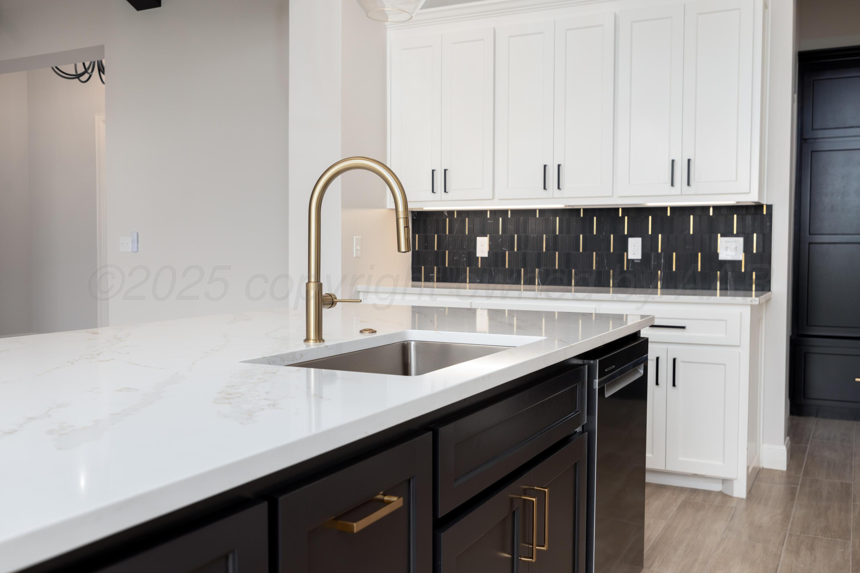 10250 Prickly Pear Road Amarillo, TX 79119 - Photo 10 of 41 a kitchen with a sink and cabinets