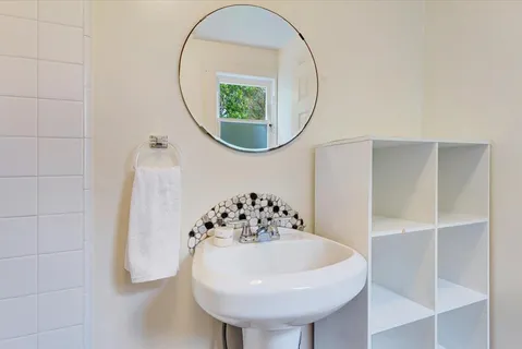 a bathroom with a sink and a mirror
