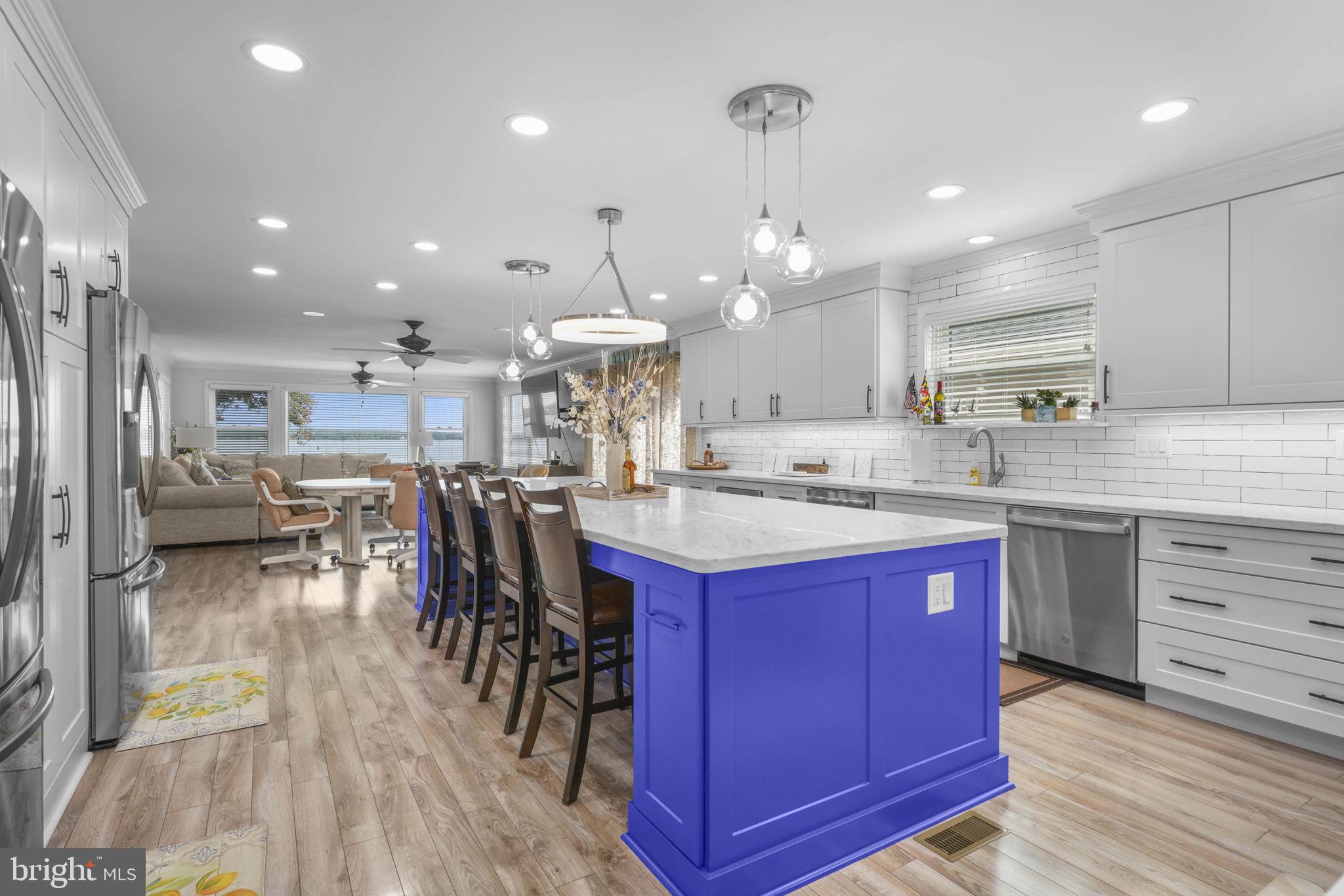 17432 Rock Point Road Newburg, MD 20664 - Photo 13 of 55 a kitchen with stainless steel appliances kitchen island granite countertop a large center island attached withe living room