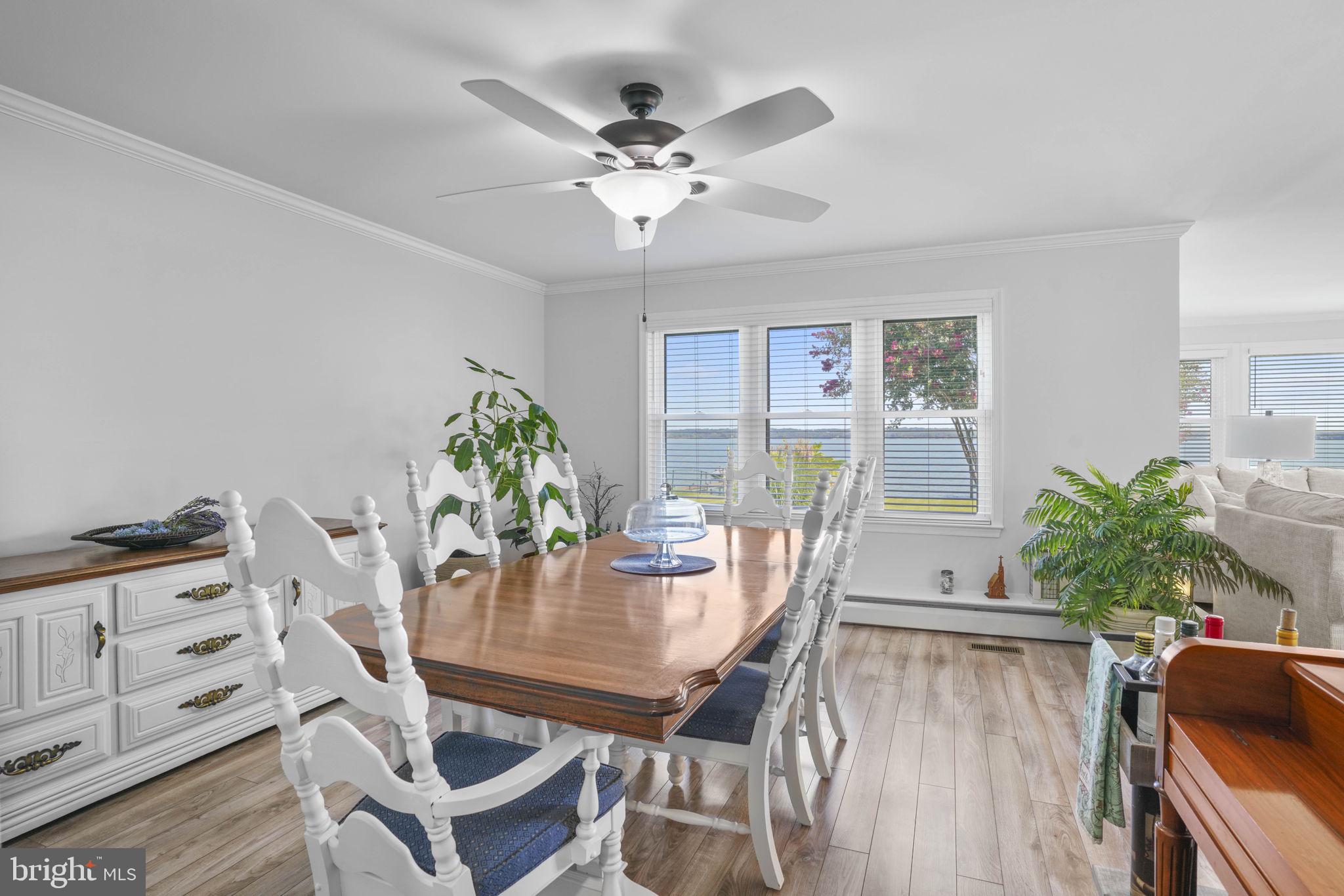 17432 Rock Point Road Newburg, MD 20664 - Photo 16 of 55 a view of a dining room with furniture and wooden floor