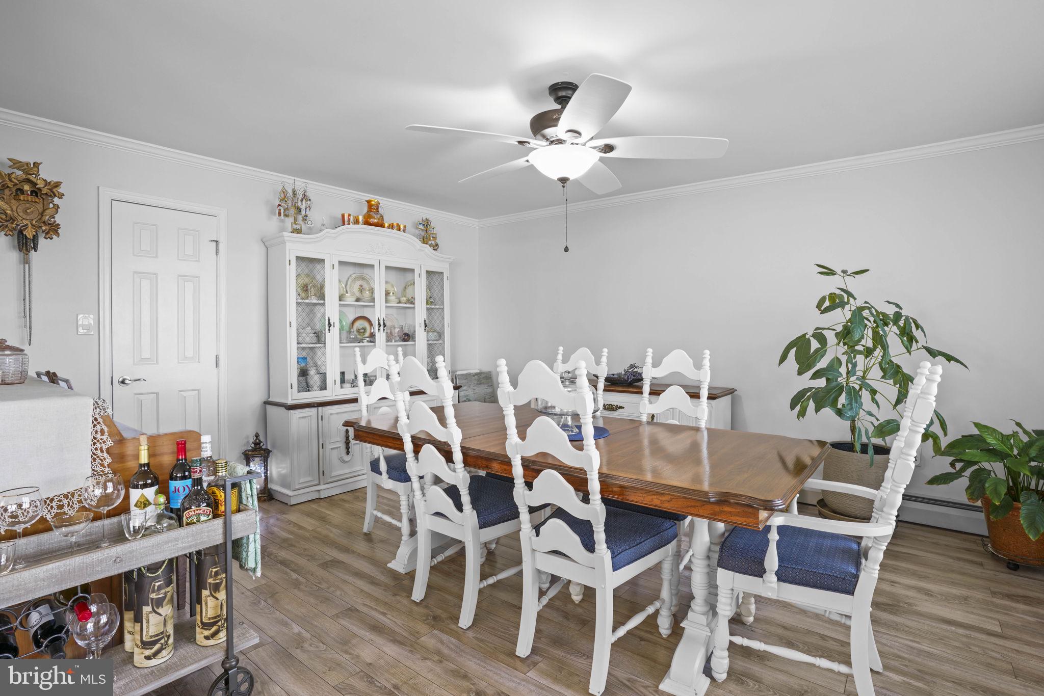 17432 Rock Point Road Newburg, MD 20664 - Photo 17 of 55 a view of a dining room with furniture and wooden floor