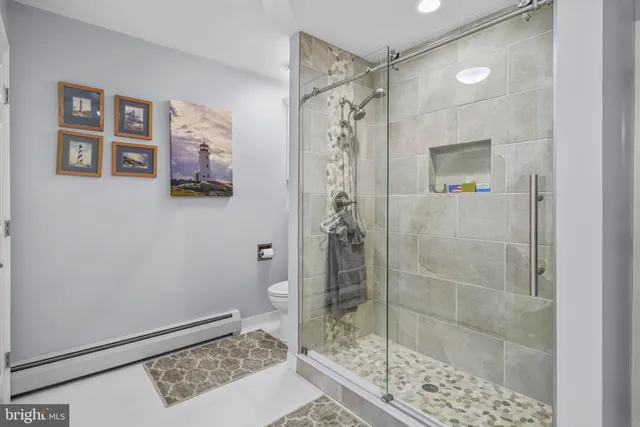 a bathroom with a sink vanity and mirror