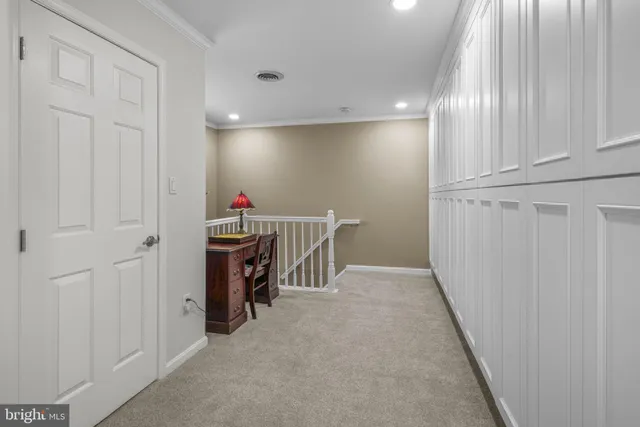 a living room with furniture a flat screen tv and a large window