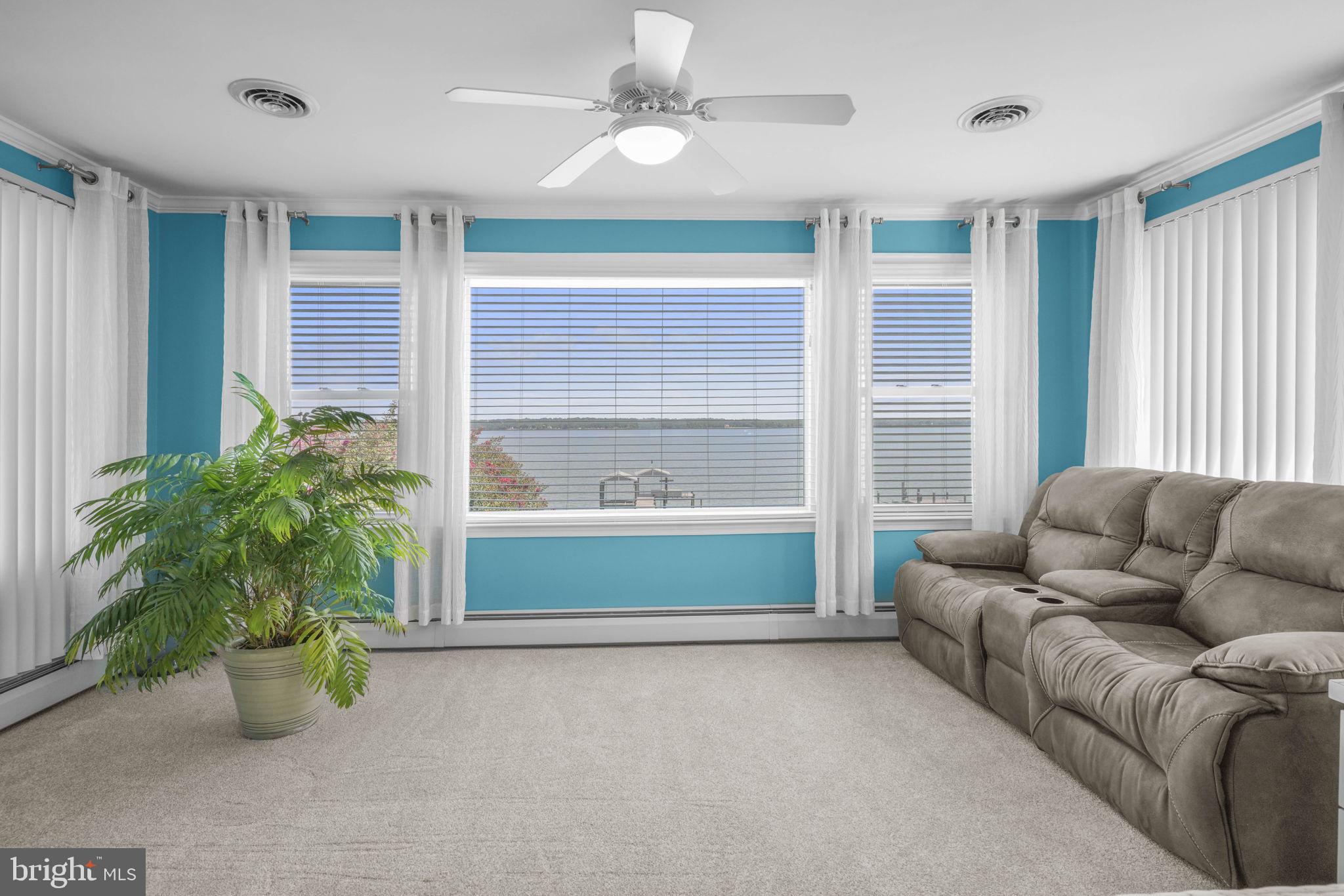 17432 Rock Point Road Newburg, MD 20664 - Photo 27 of 55 a living room with furniture and a potted plant