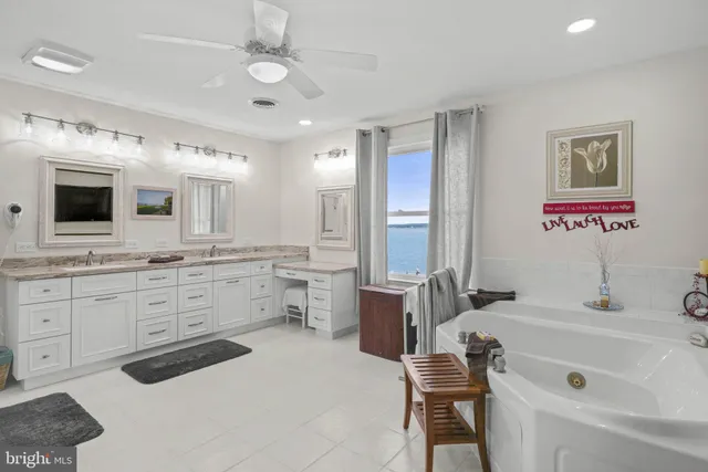 a bathroom with a tub and a sink
