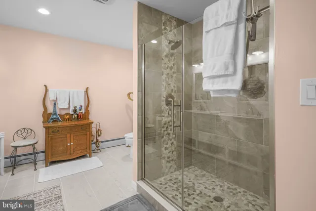 a spacious bathroom with a double vanity sink and a mirror