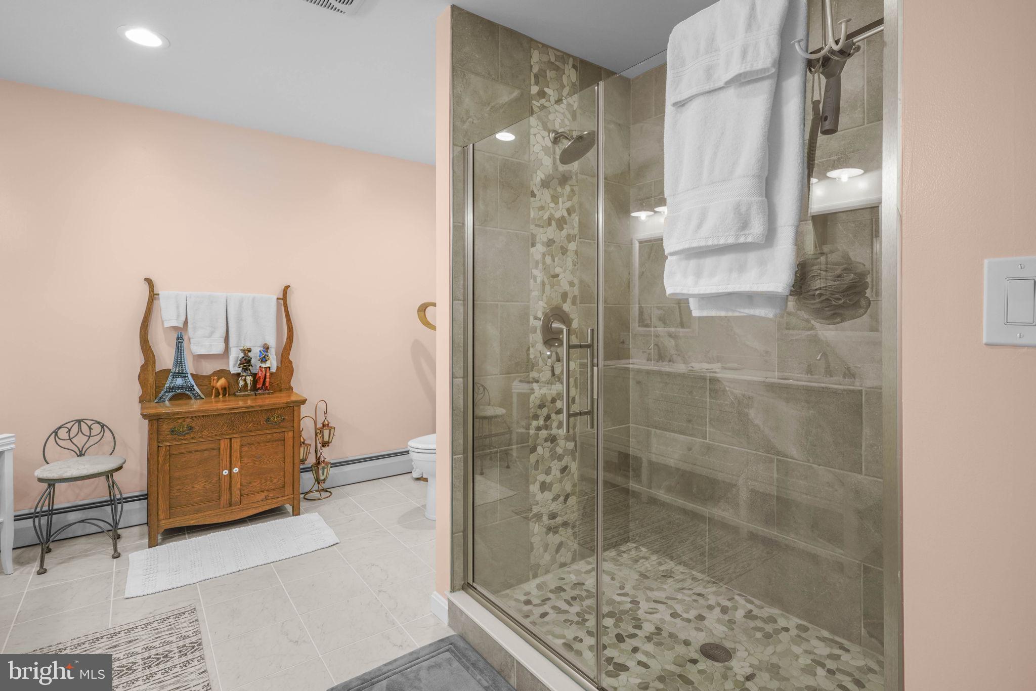 17432 Rock Point Road Newburg, MD 20664 - Photo 35 of 55 a bathroom with a mirror and a shower