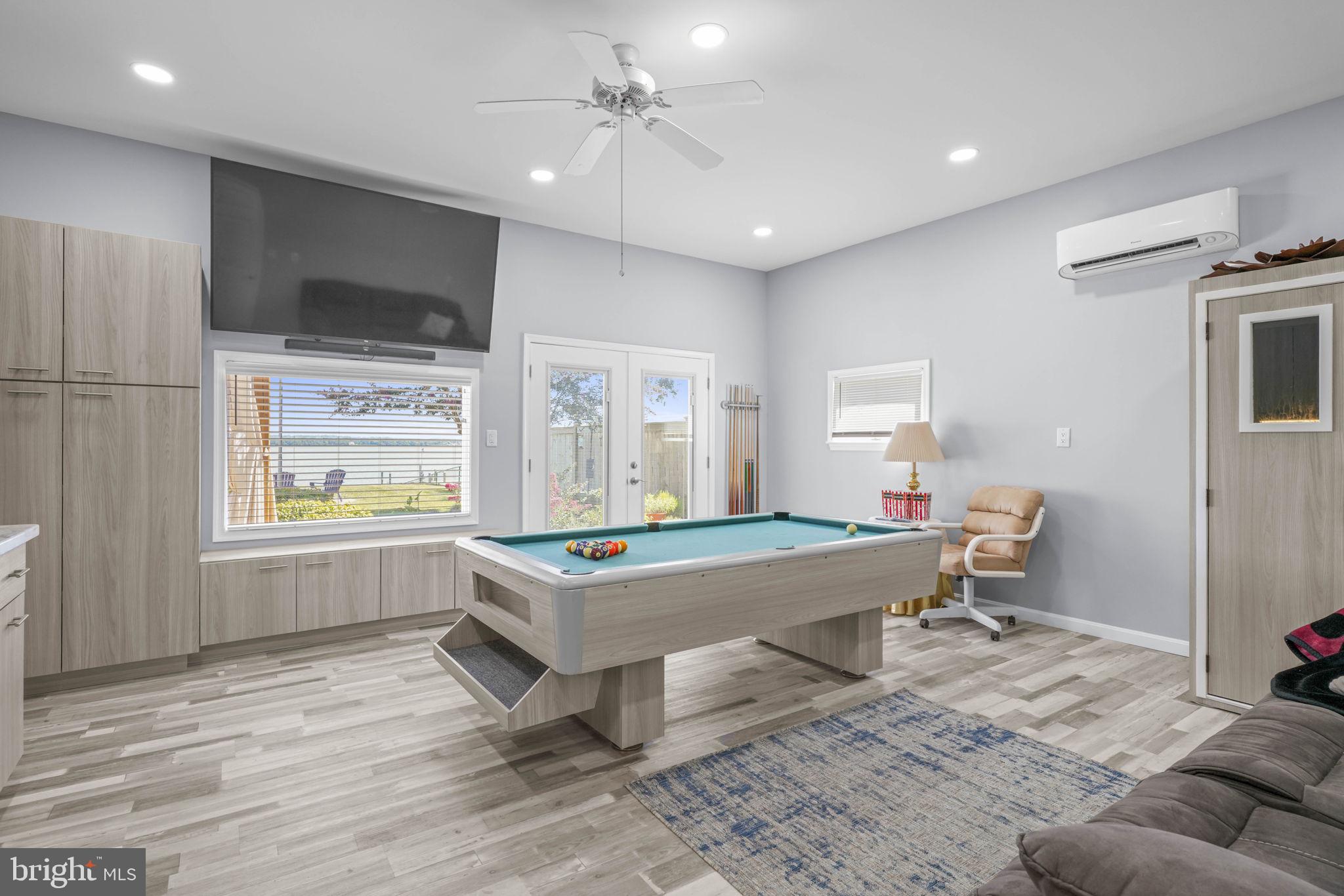 17432 Rock Point Road Newburg, MD 20664 - Photo 38 of 55 a living room with a table chairs and a window