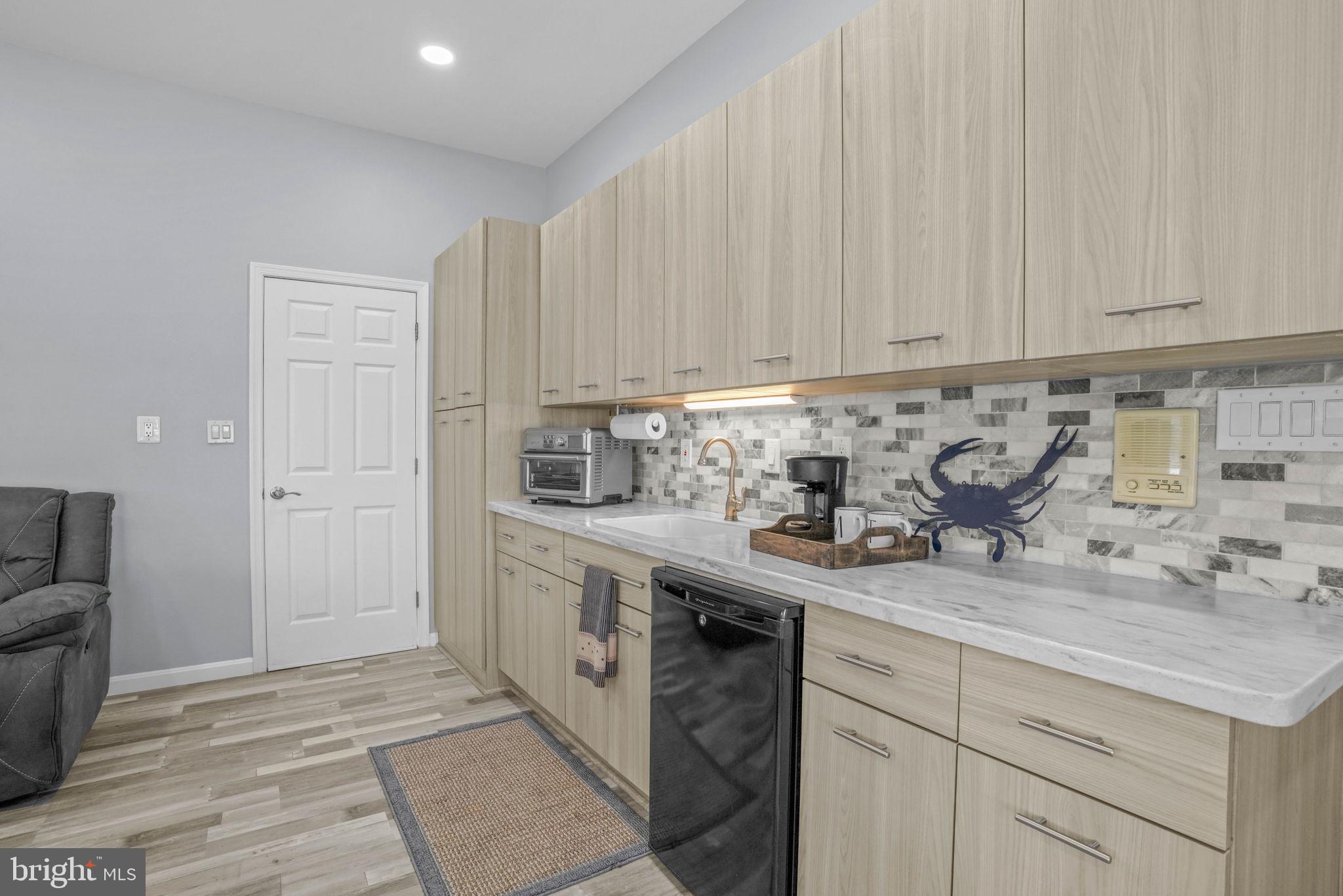 17432 Rock Point Road Newburg, MD 20664 - Photo 39 of 55 a kitchen with stainless steel appliances granite countertop a sink stove and cabinets
