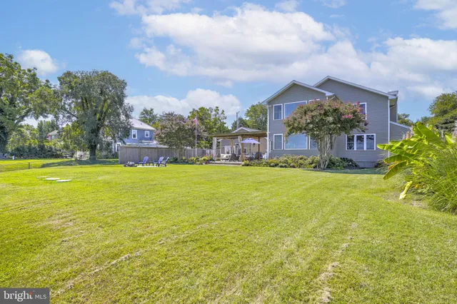 a view of swimming pool is middle in the garden