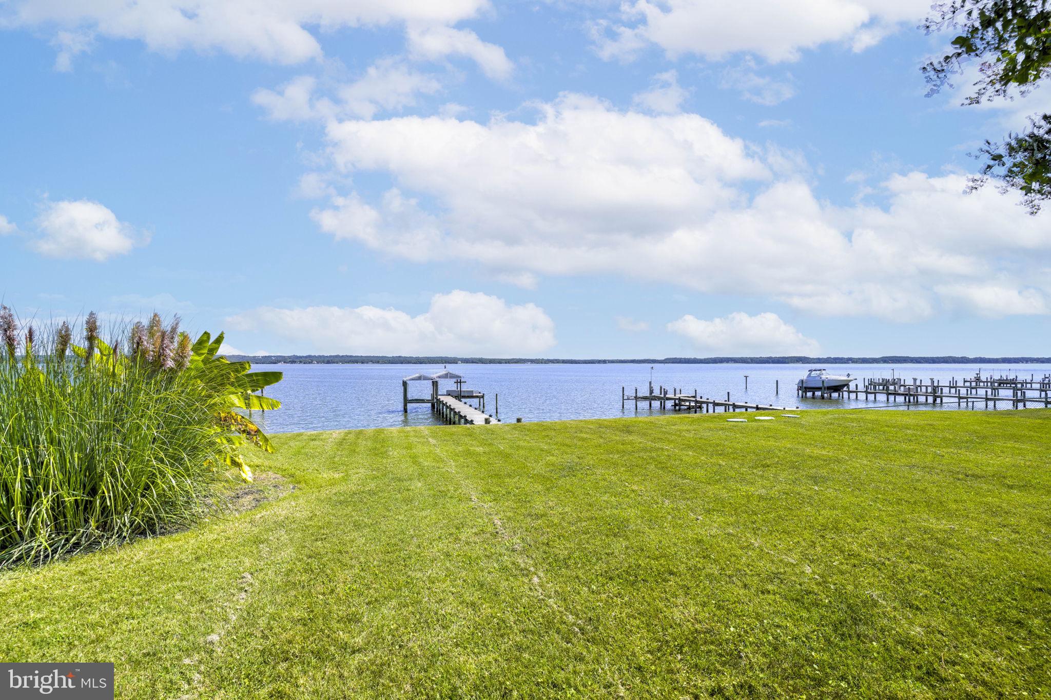 17432 Rock Point Road Newburg, MD 20664 - Photo 45 of 55 a view of a lake with houses in the back