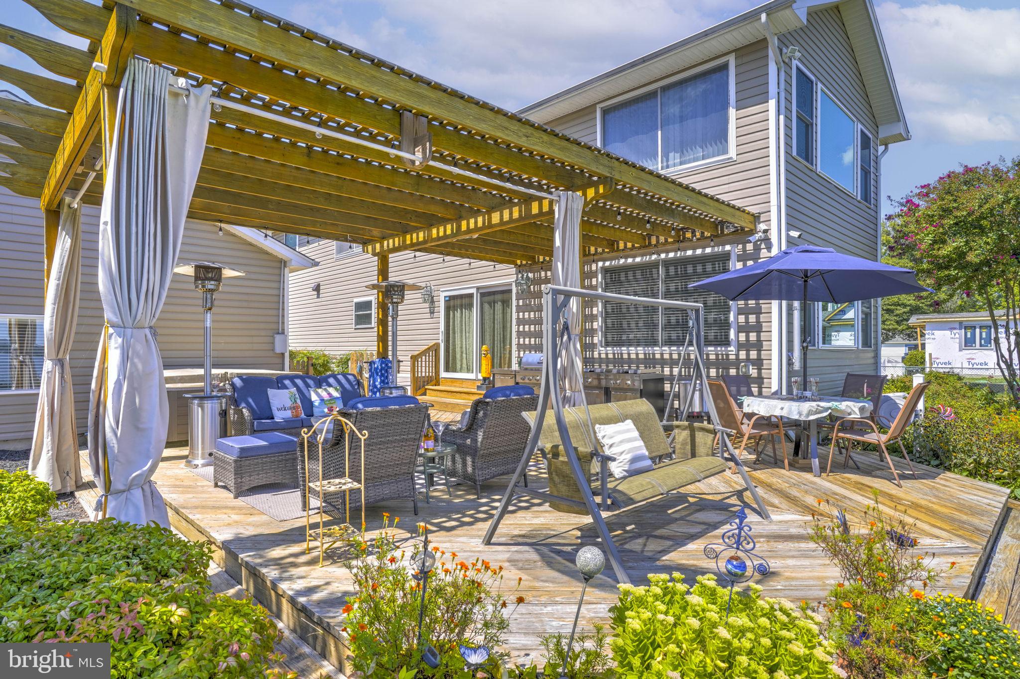 17432 Rock Point Road Newburg, MD 20664 - Photo 48 of 55 a view of a patio with table and chairs under an umbrella