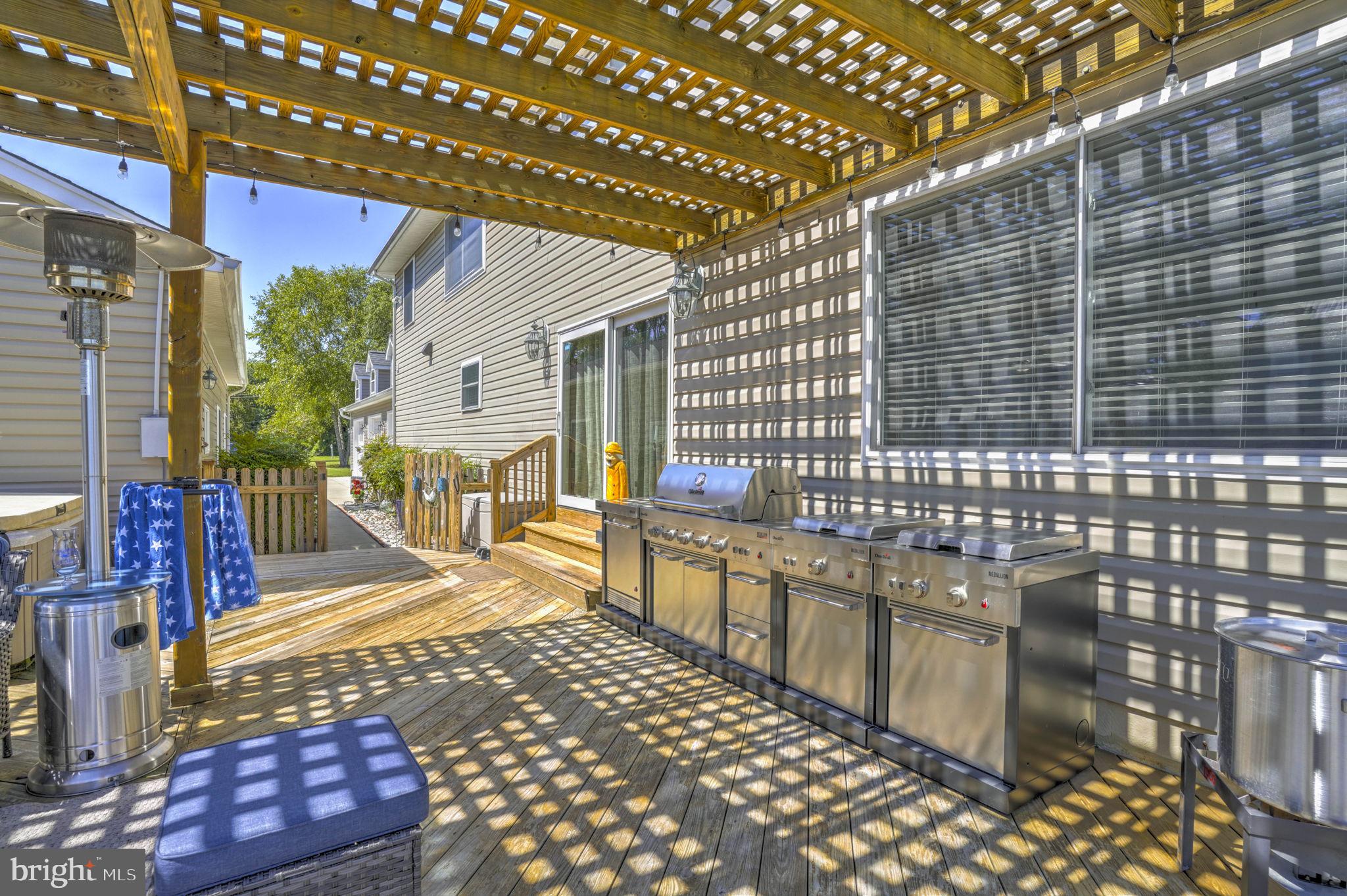 17432 Rock Point Road Newburg, MD 20664 - Photo 49 of 55 a view of a patio with a table and chairs