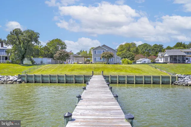 a view of a swimming pool with an outdoor space and seating area
