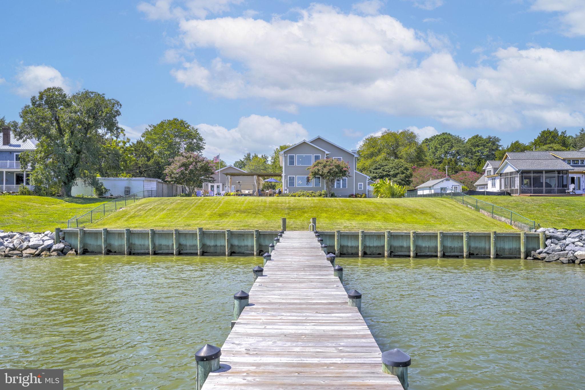 17432 Rock Point Road Newburg, MD 20664 - Photo 5 of 55 a view of a swimming pool with an outdoor space and seating area