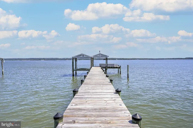 a kitchen with stainless steel appliances cabinets and a window