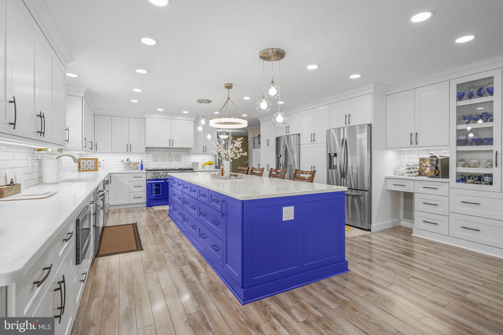 17432 Rock Point Road Newburg, MD 20664 - Photo 8 of 55 a kitchen with kitchen island granite countertop a sink cabinets and stainless steel appliances