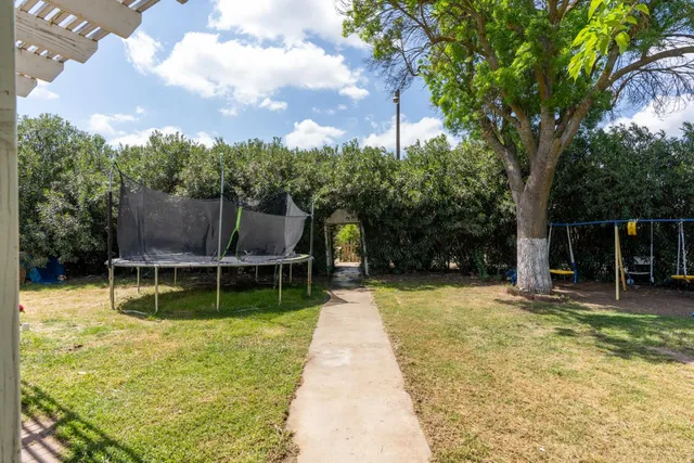 a view of a backyard with sitting area