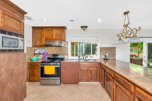 a kitchen with a stove and a microwave