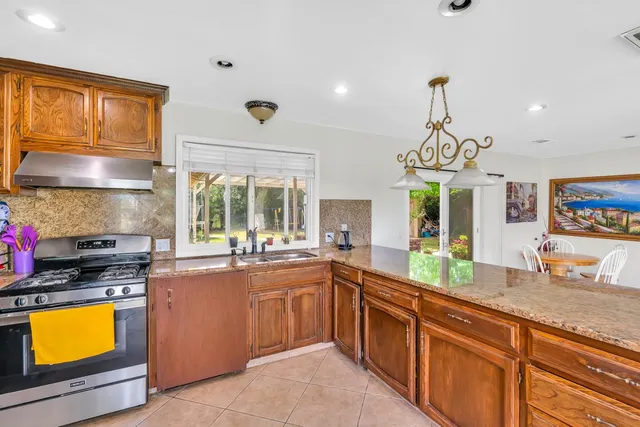 a bed room with a bed and a chair