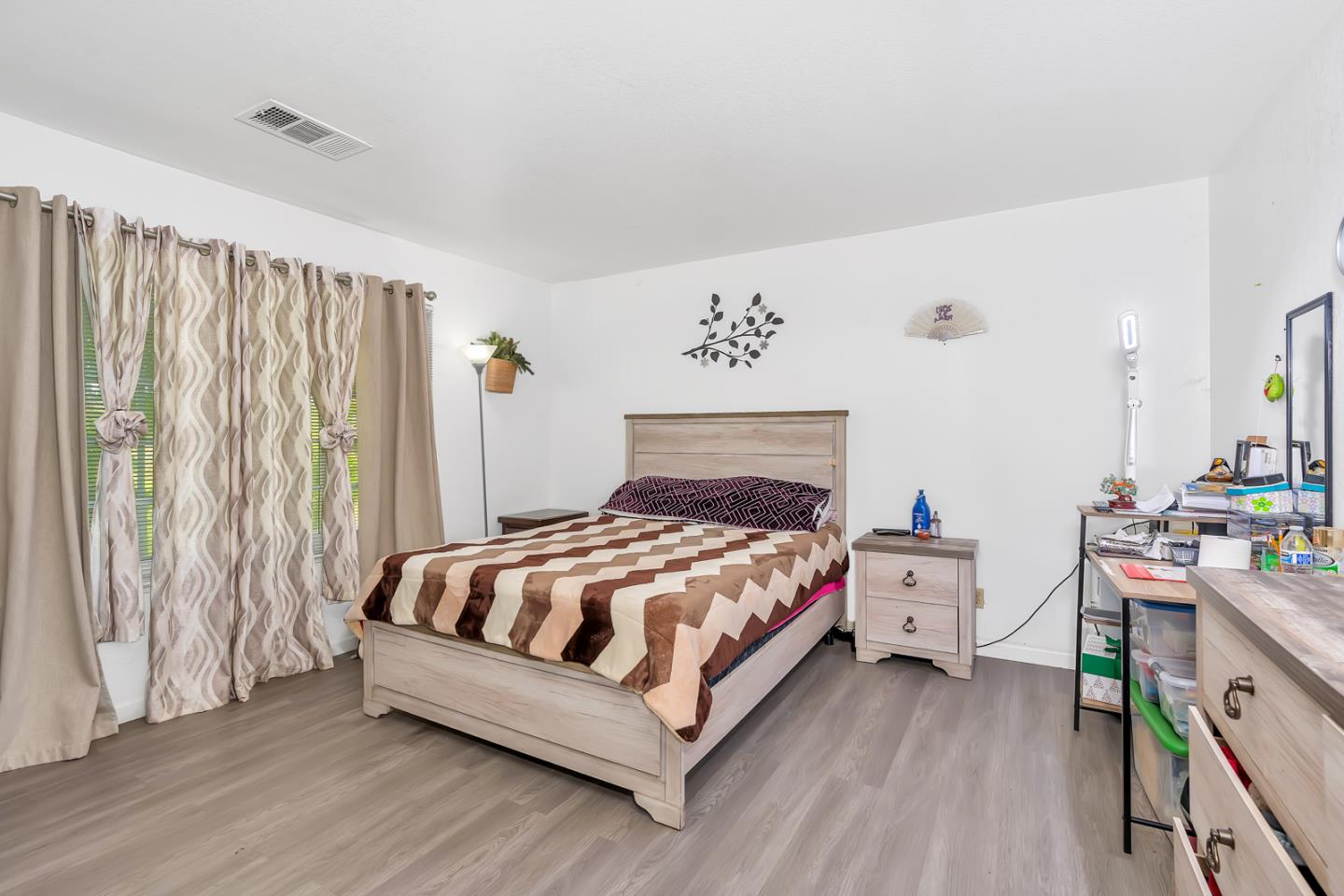 2965 Dunn Road Merced, CA 95340 - Photo 28 of 68 a bedroom with a bed table and a window