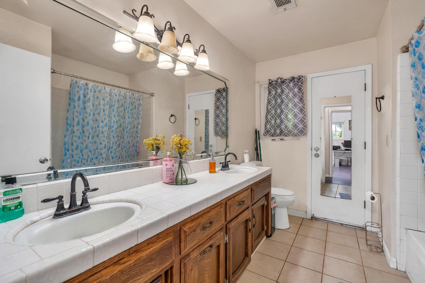 2965 Dunn Road Merced, CA 95340 - Photo 31 of 68 a bathroom with a sink double vanity granite and a mirror