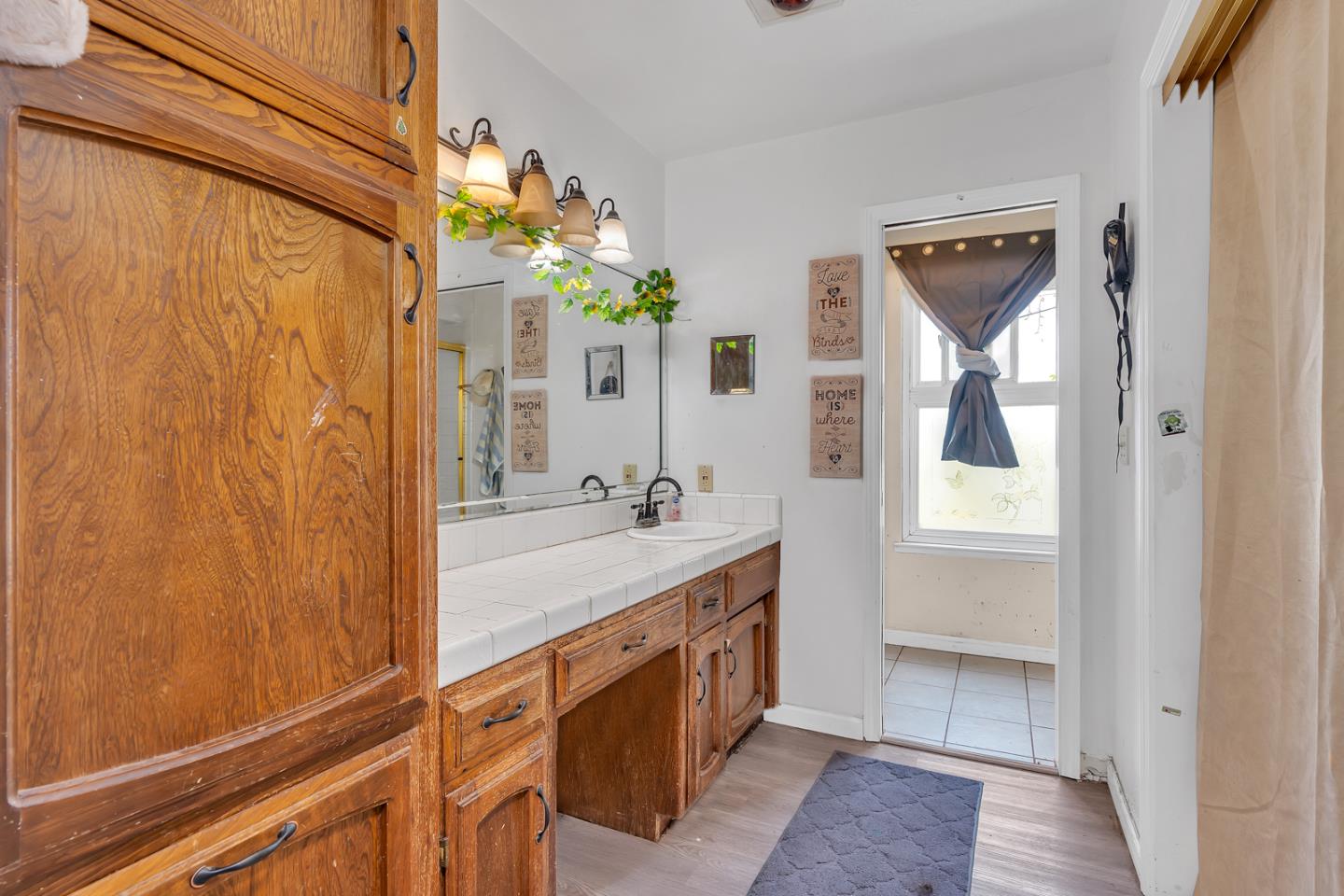 2965 Dunn Road Merced, CA 95340 - Photo 35 of 68 a bathroom with a double vanity sink and a mirror