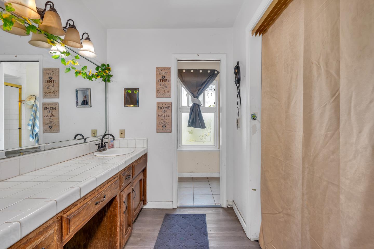 2965 Dunn Road Merced, CA 95340 - Photo 36 of 68 a spacious bathroom with a double vanity sink and a mirror