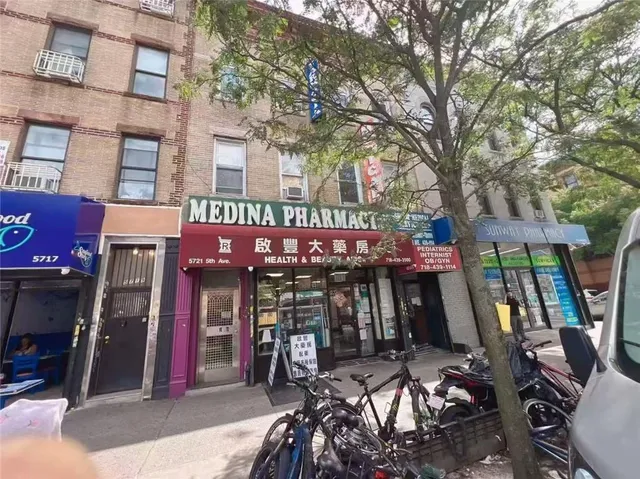 a view of a cafe with sitting area