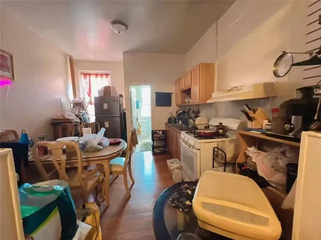a room with dining table and chairs