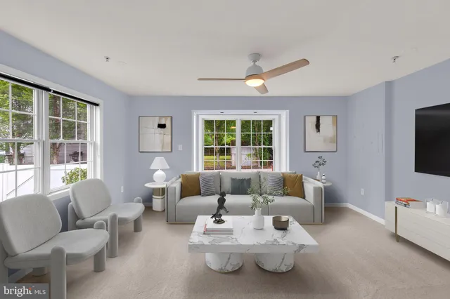 a spacious bedroom with a bed and a flat screen tv