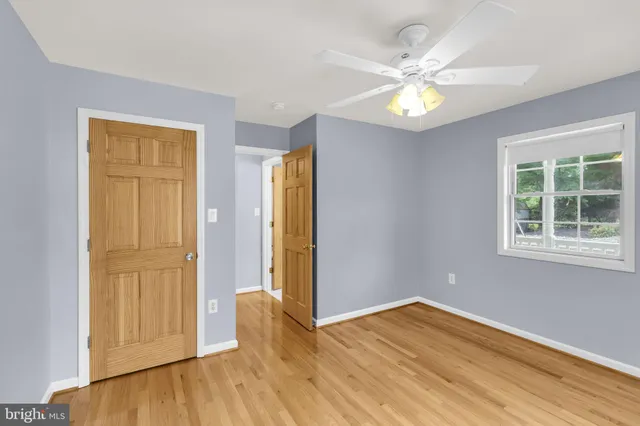 a spacious bathroom with a double vanity sink mirror and toilet