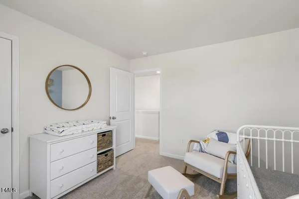 a bathroom with a toilet a sink and a mirror