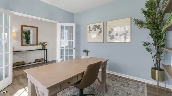 a view of a dining room with furniture and window