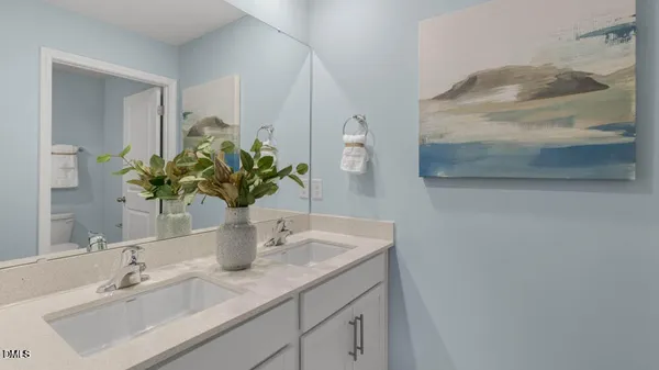 a bathroom with a sink a vanity and a mirror