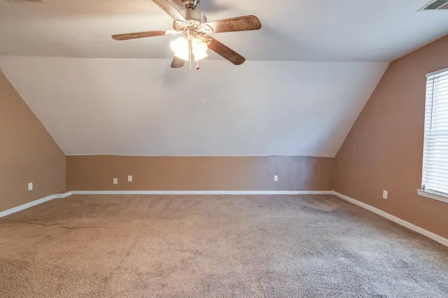 wooden floor and window in an empty room