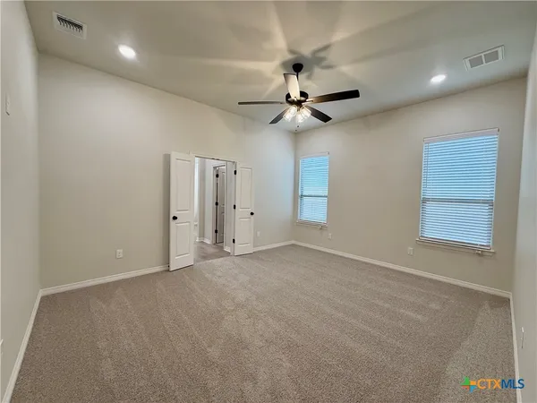 a view of an empty room with a window